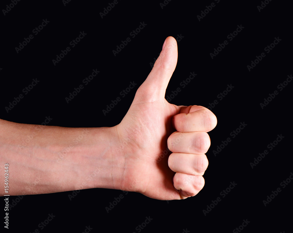Thumbs up hand isolated on black background Thumbs up hand isolated on black background