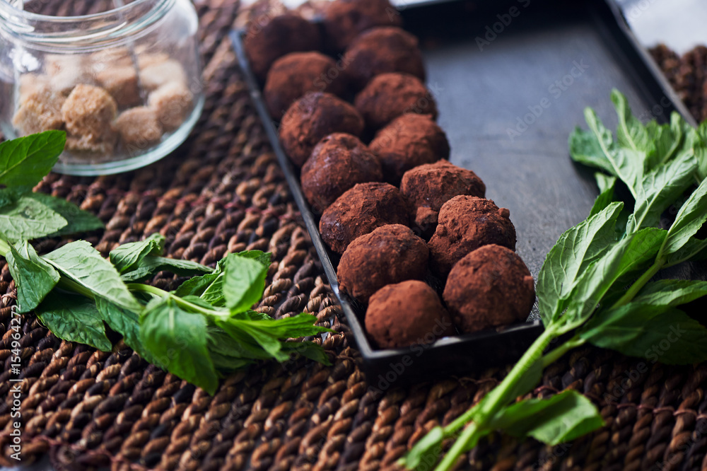 A lot of delicious round chocolate truffles. A work of culinary art A lot of delicious round chocolate truffles. A work of culinary art