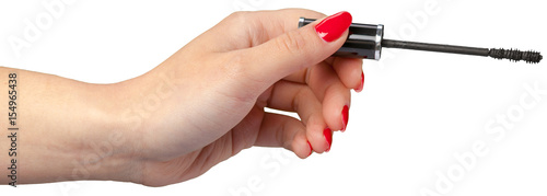 woman hand holding eyelash brush