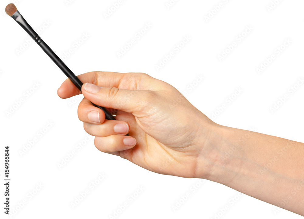 woman hand holding face brush woman hand holding face brush
