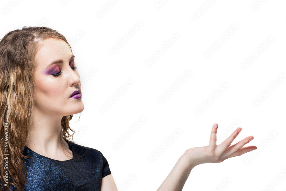 Woman showing product .Beautiful casual young woman holding out her hand, presenting your product. Isolated on white background. Woman showing product .Beautiful casual young woman holding out her hand, presenting your product. Isolated on white background.