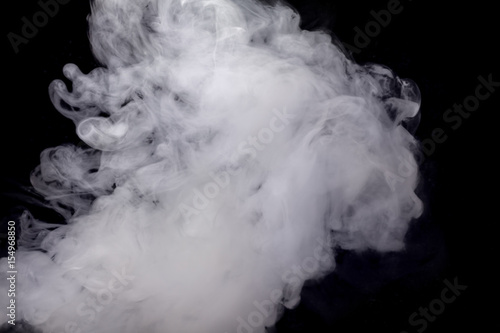 Abstract white smoke against dark background