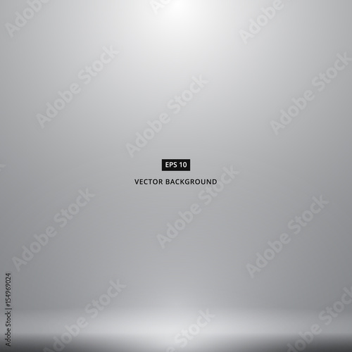Smooth Dark grey white with Black vignette studio room background with light shines from above.