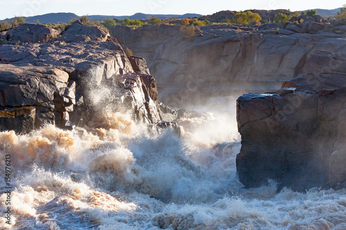 Dangerous waters as the Orange River, in full flood, races towards the spectacular Augrabies Falls.   