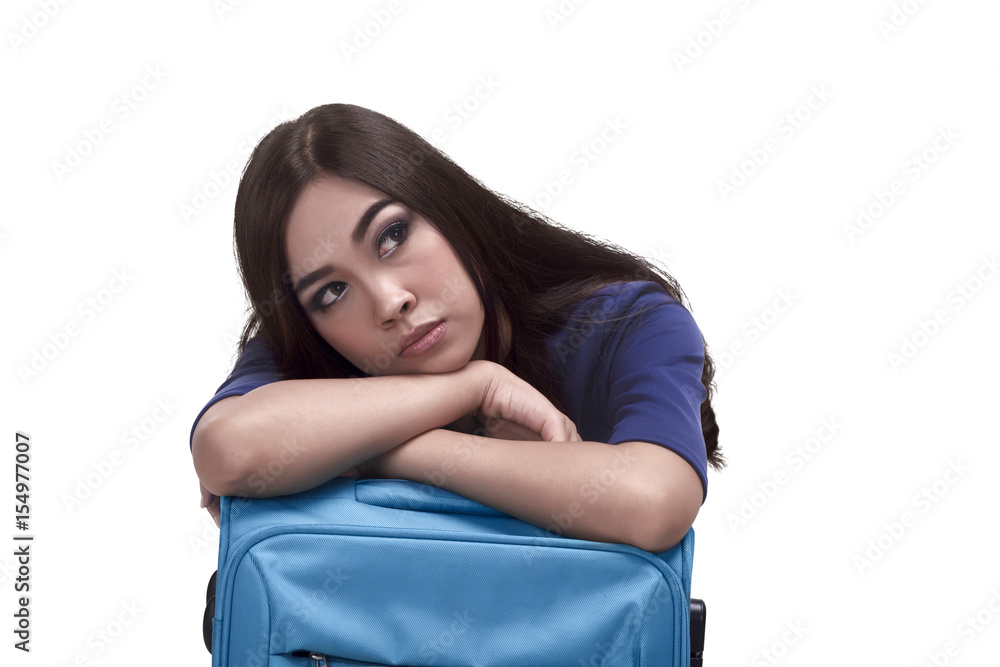 Beautiful asian woman traveler embrace a blue suitcase Beautiful asian woman traveler embrace a blue suitcase