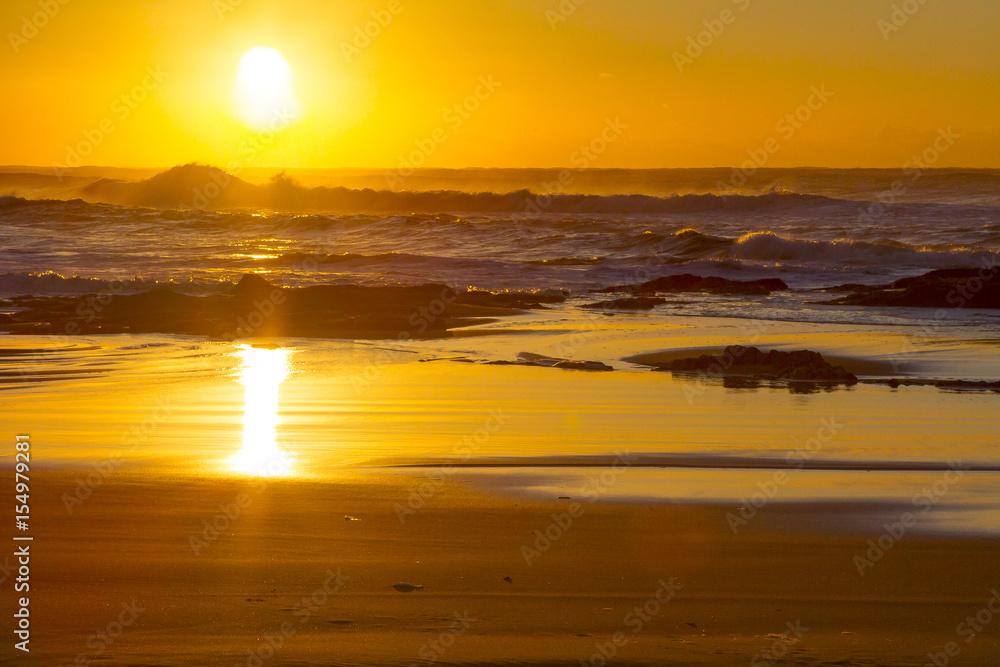 A placid early morning sunrise at Baggies Beach near Durban, South Africa.  