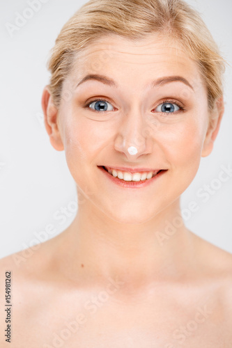 Portrait of young pretty girl over white background.