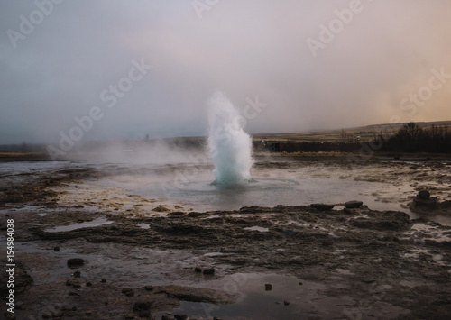 Beautiful geyser valley in Iceland.Erupting geyser 