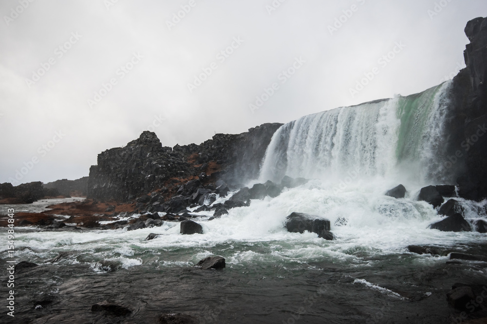 Beautiful waterfall at the Thingvellir national park in Iceland