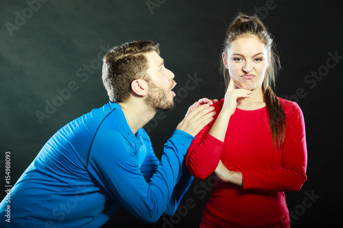 Valokuva Regretful man husband apologizing woman wife.