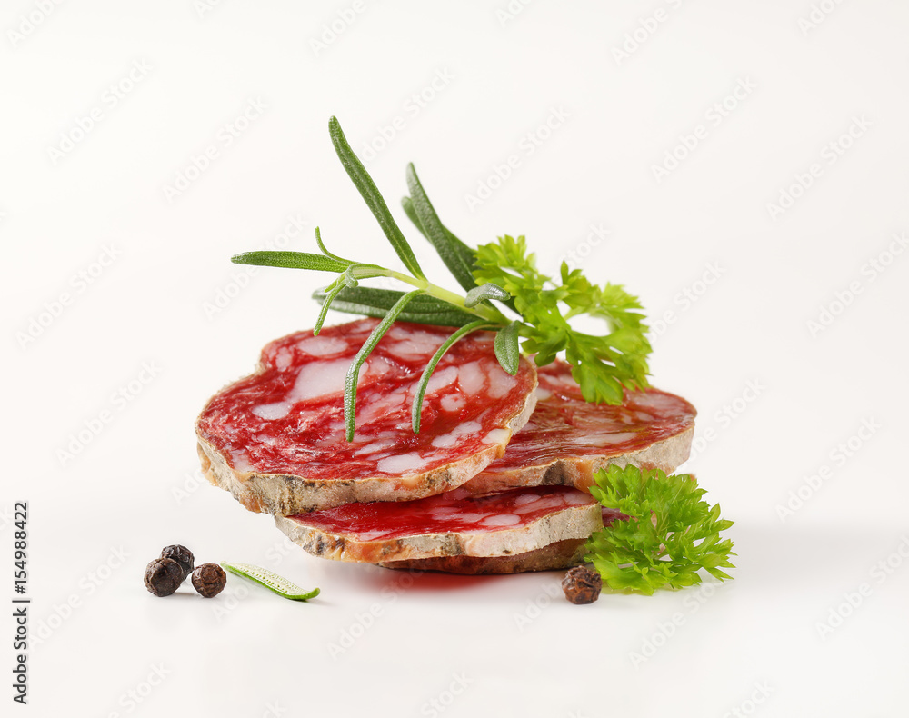 slices of dry cured salami with spices