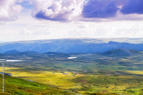 Valley in mountains. Norway landscape with small village