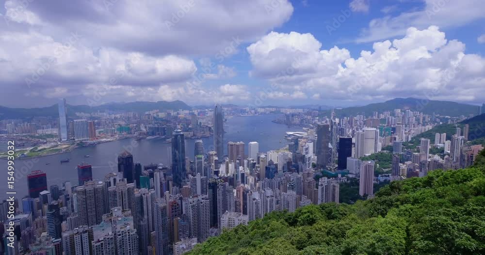 Hong Kong city skyline and harbor. Super wide tilt down shot taken from Victoria Peak. Hong Kong city skyline and harbor. Super wide tilt down shot taken from Victoria Peak.