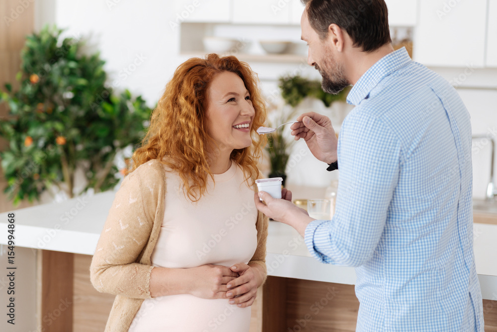 Husband taking care of full term pregnant wife Husband taking care of full term pregnant wife