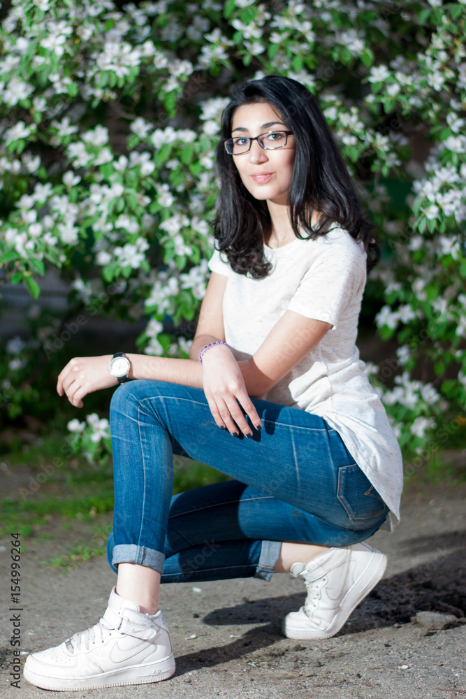 Girl in a white T-shirt outdoors Girl in a white T-shirt outdoors