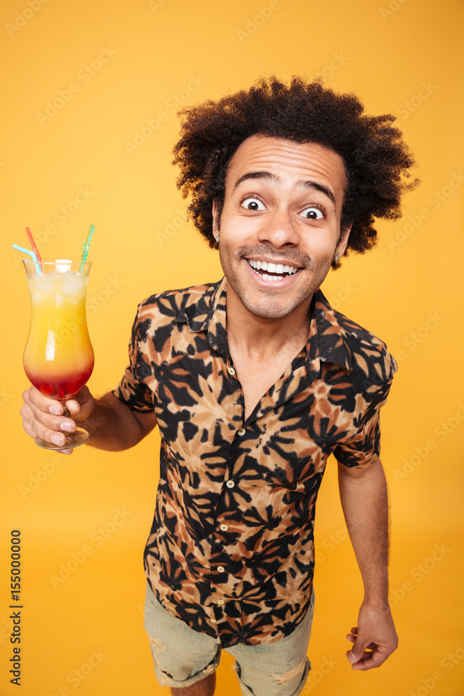 Young happy african man drinking cocktail. Young happy african man drinking cocktail.