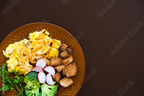 Home made fresh omelette for breakfast with vegetables vitamins. Broccoli omelette breakfast background. Fresh omelette with vitamins on plate. photo