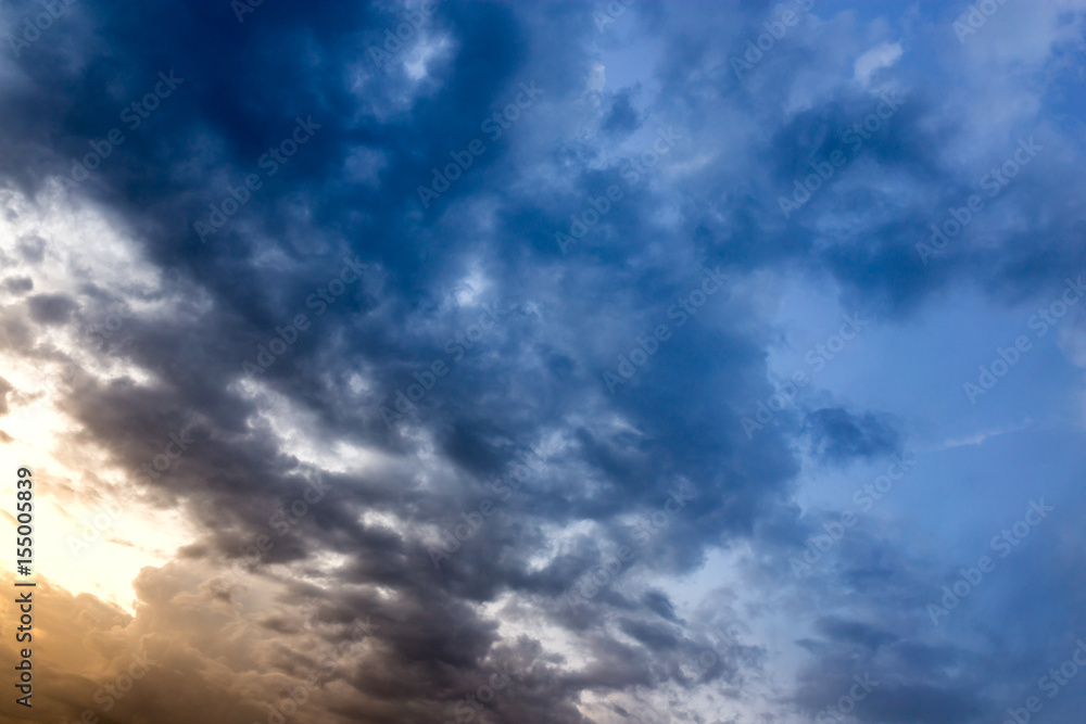 Fototapeta premium Beautiful clouds at sunset after rain as background .