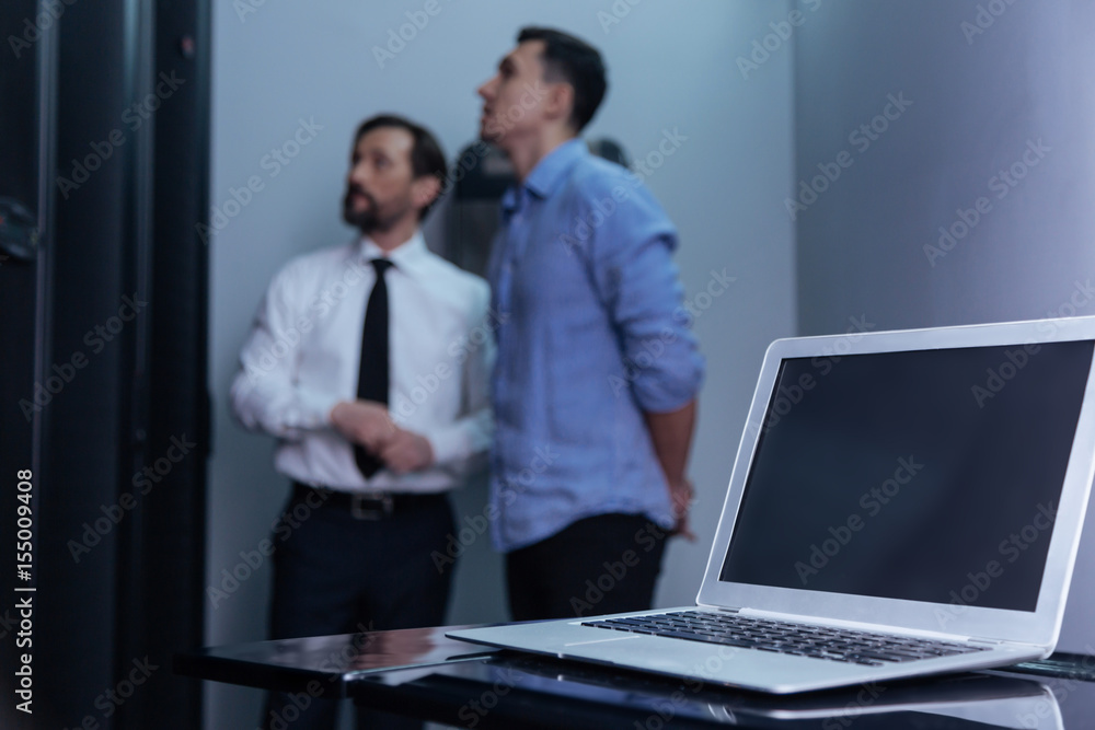 Modern innovative laptop standing on the table Modern innovative laptop standing on the table