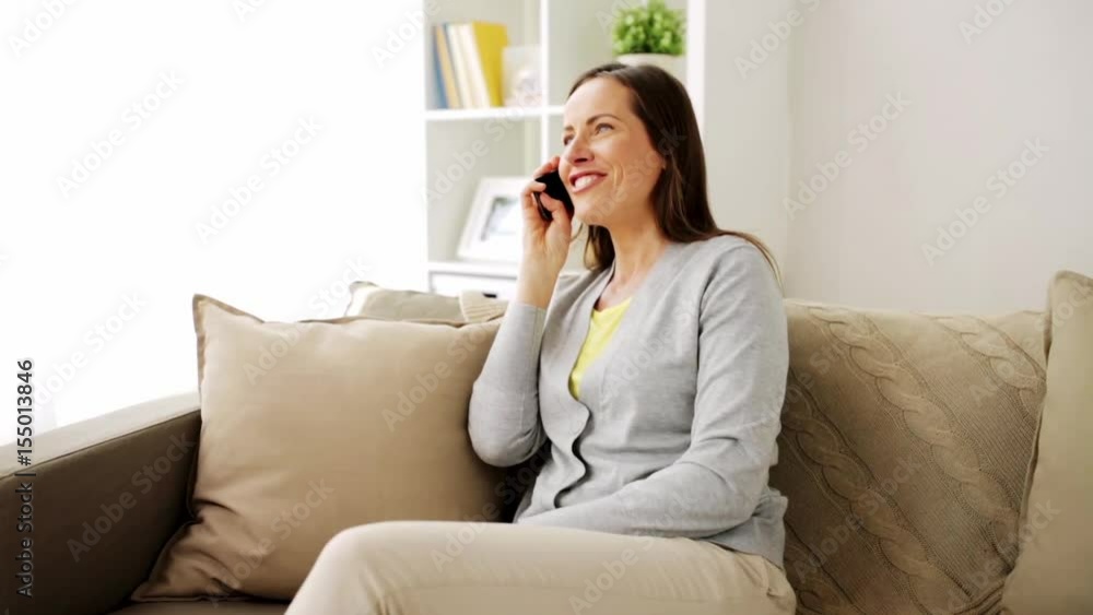 happy woman calling on smartphone at home happy woman calling on smartphone at home