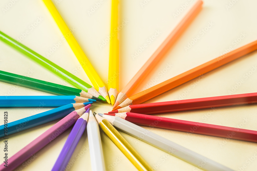 Business concept - Top view of color pencil circle on yellow paper background, teamwork, united and communication concept Business concept - Top view of color pencil circle on yellow paper background, teamwork, united and communication concept