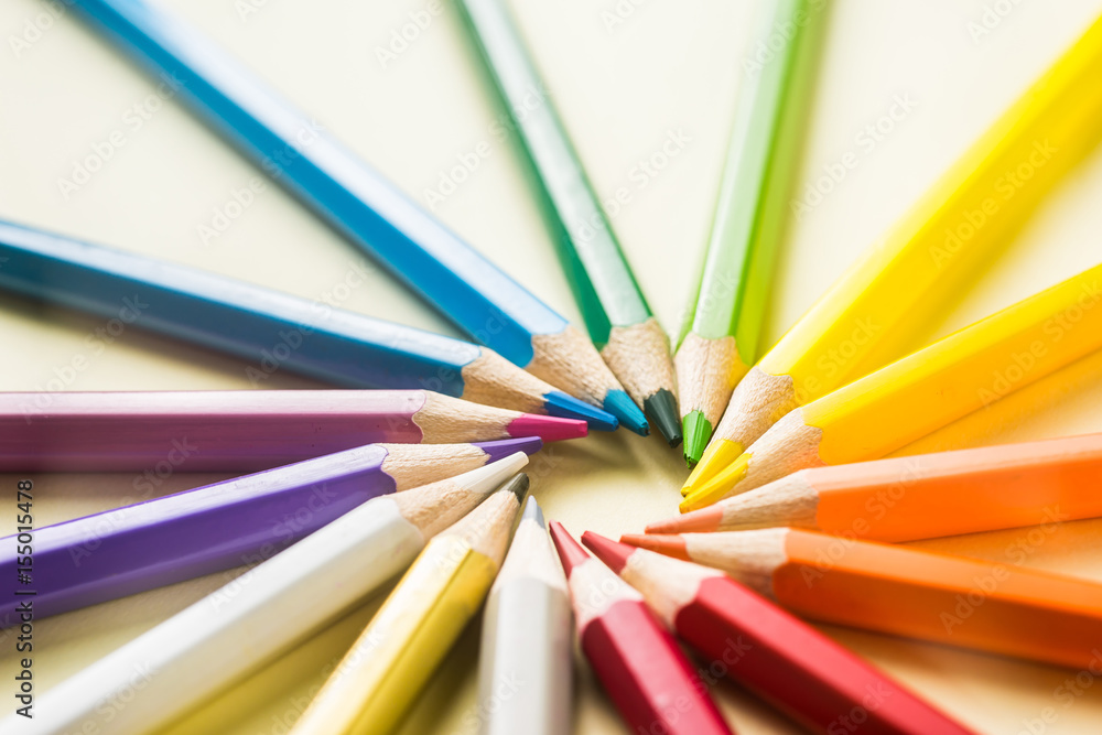 Business concept - Top view of color pencil circle on yellow paper background, teamwork, united and communication concept Business concept - Top view of color pencil circle on yellow paper background, teamwork, united and communication concept