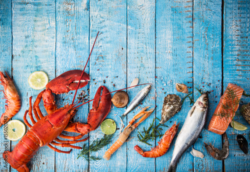 Canvas Print Fresh tasty seafood served on old wooden table.