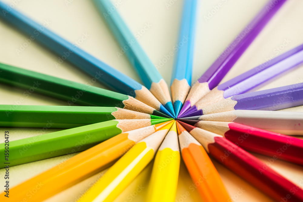 Business concept - Top view of color pencil circle on yellow paper background, teamwork, united and communication concept Business concept - Top view of color pencil circle on yellow paper background, teamwork, united and communication concept