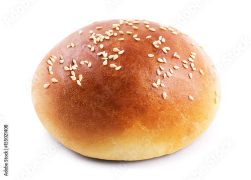 Burger bun with sesame seeds isolated on white background with clipping path