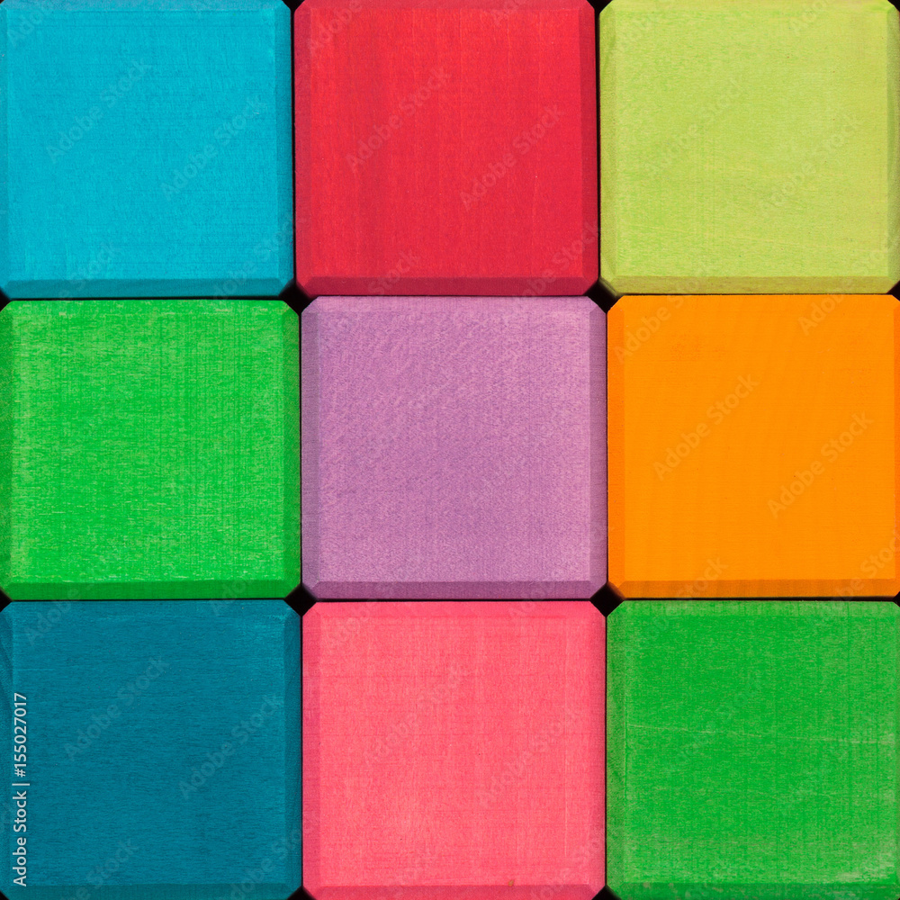 Fototapeta premium Wooden color cubes background. Colorful wooden texture
