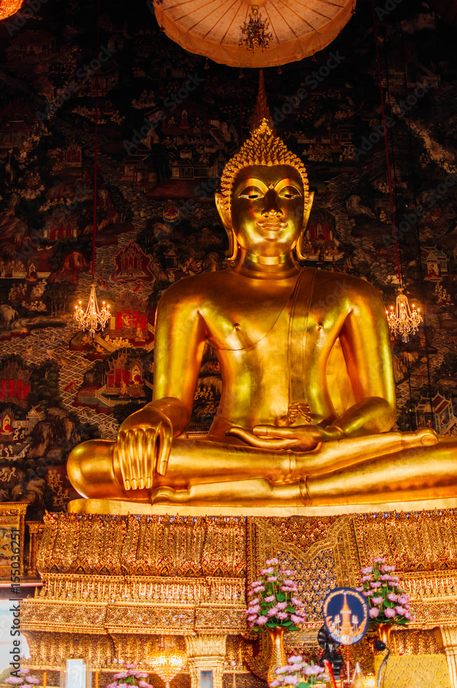 giant buddha in one of the temples in bangkok in lotus pose giant buddha in one of the temples in bangkok in lotus pose