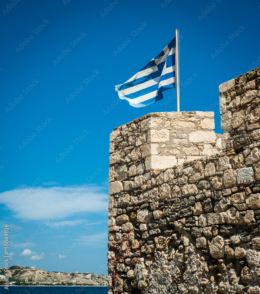 Greek flag on the top of fortifications. Greece, Crete, fortification