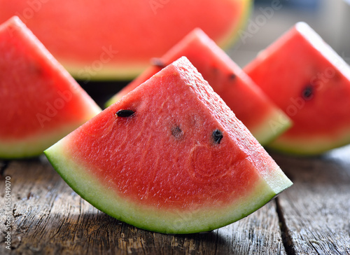 watermelon sliced on wooden background photo
