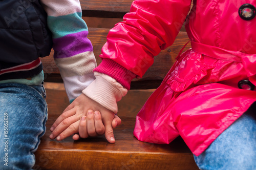 children Girl and boy holding hands