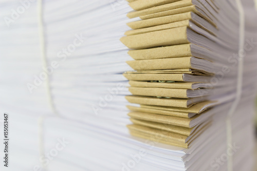 Pile of unfinished documents on office desk, Stack of business paper