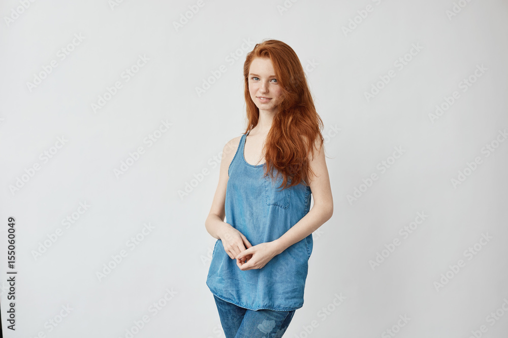 Beautiful model with foxy hair smiling looking at camera. Beautiful model with foxy hair smiling looking at camera.