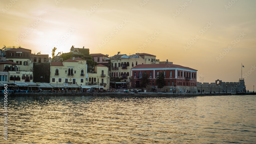 Greece, Crete, sunset in Chania (Xania) evening light to city harbour