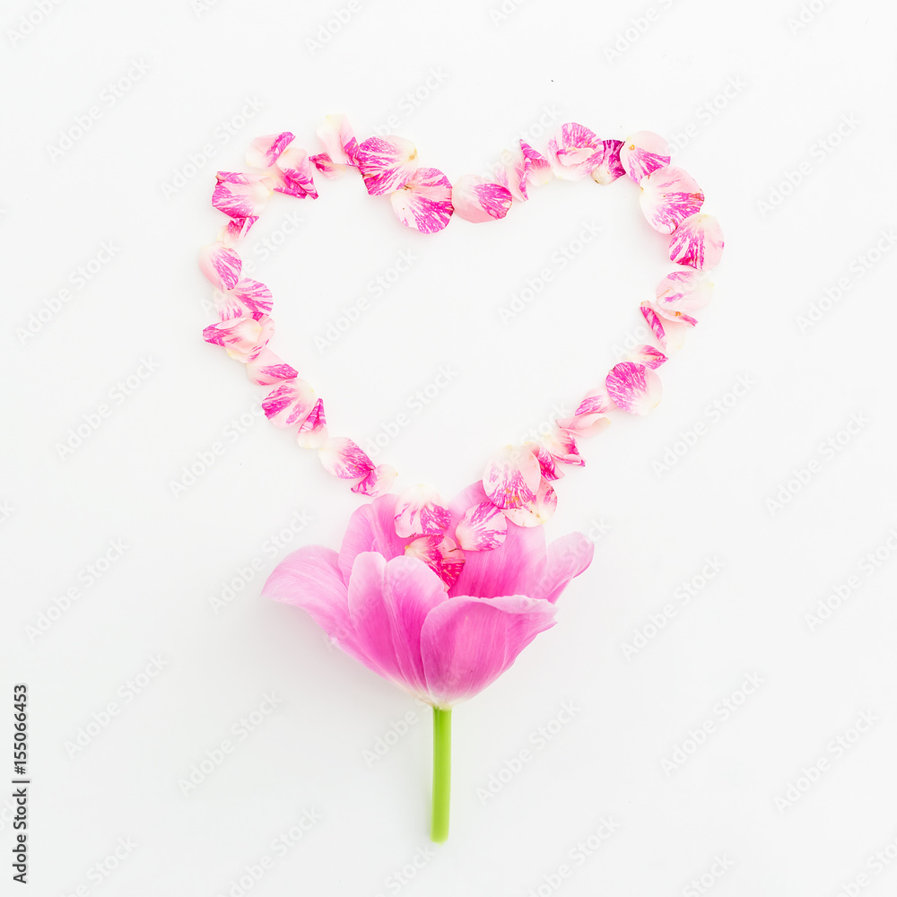 Heart symbol of roses petals and tulip flower on white background. Flat lay, Top view