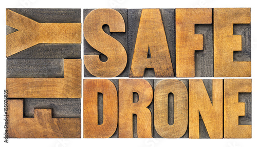 fly safe drone word abstract in wood type