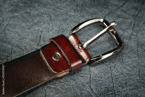 Female belt against from a  leather grey