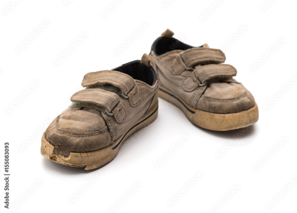 pair of old grey shoes on a white background pair of old grey shoes on a white background