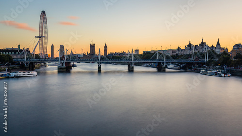 View of Westminster Parliament and London Eye with the river Thames in the foreground