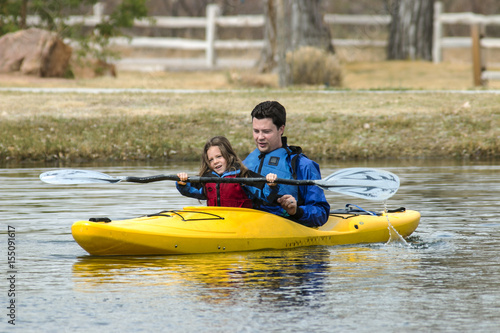 father and son kayaking on a small lake  © Brent Hall