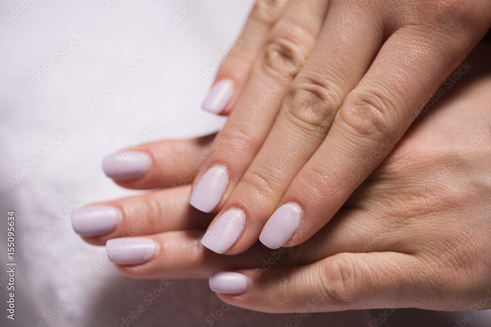 woman fingers with french manicure woman fingers with french manicure