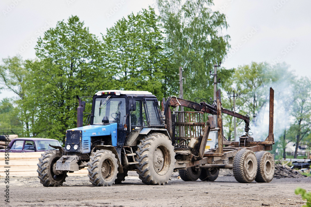 Tractor with trailer for transportation of logs Tractor with trailer for transportation of logs