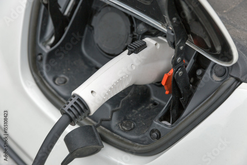 Charging an electric car closeup
