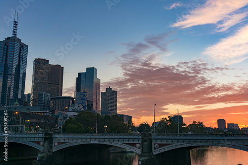 Melbourne downtown cityscape with colorful sunrise sky on the background