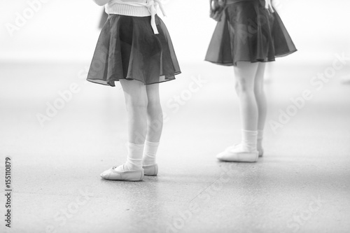 Little children at a rehearsal in a dance studio.