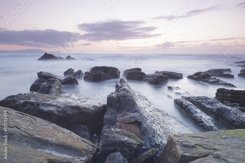 Serene seascape in Barrika beach, Biscay, Basque Country, Spain. Long exposure shot.