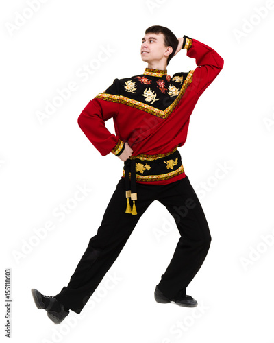 young man wearing a folk russian costume posing